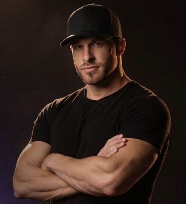 Dan Fazio in a black cap and black t-shirt, arms crossed